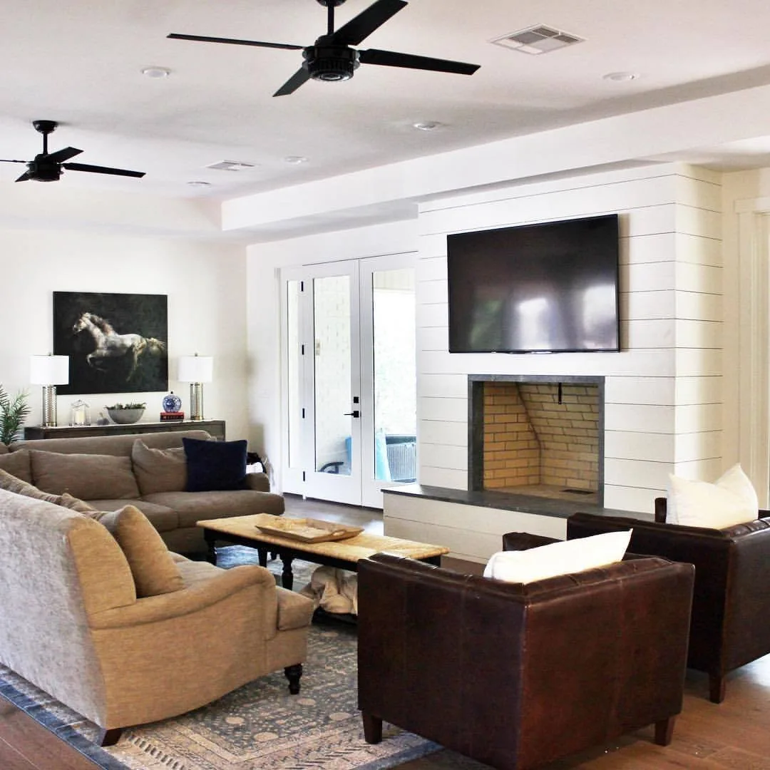 Living room with shiplap fireplace wall